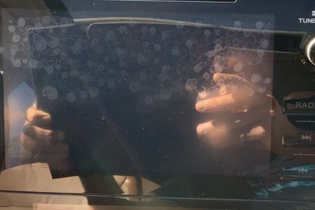 Close-up of bubbling under the glass of a Subaru Outback touchscreen
